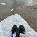 Shoes on rock by beach