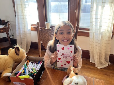 Anjali with her Valentine’s Day card for Grandma