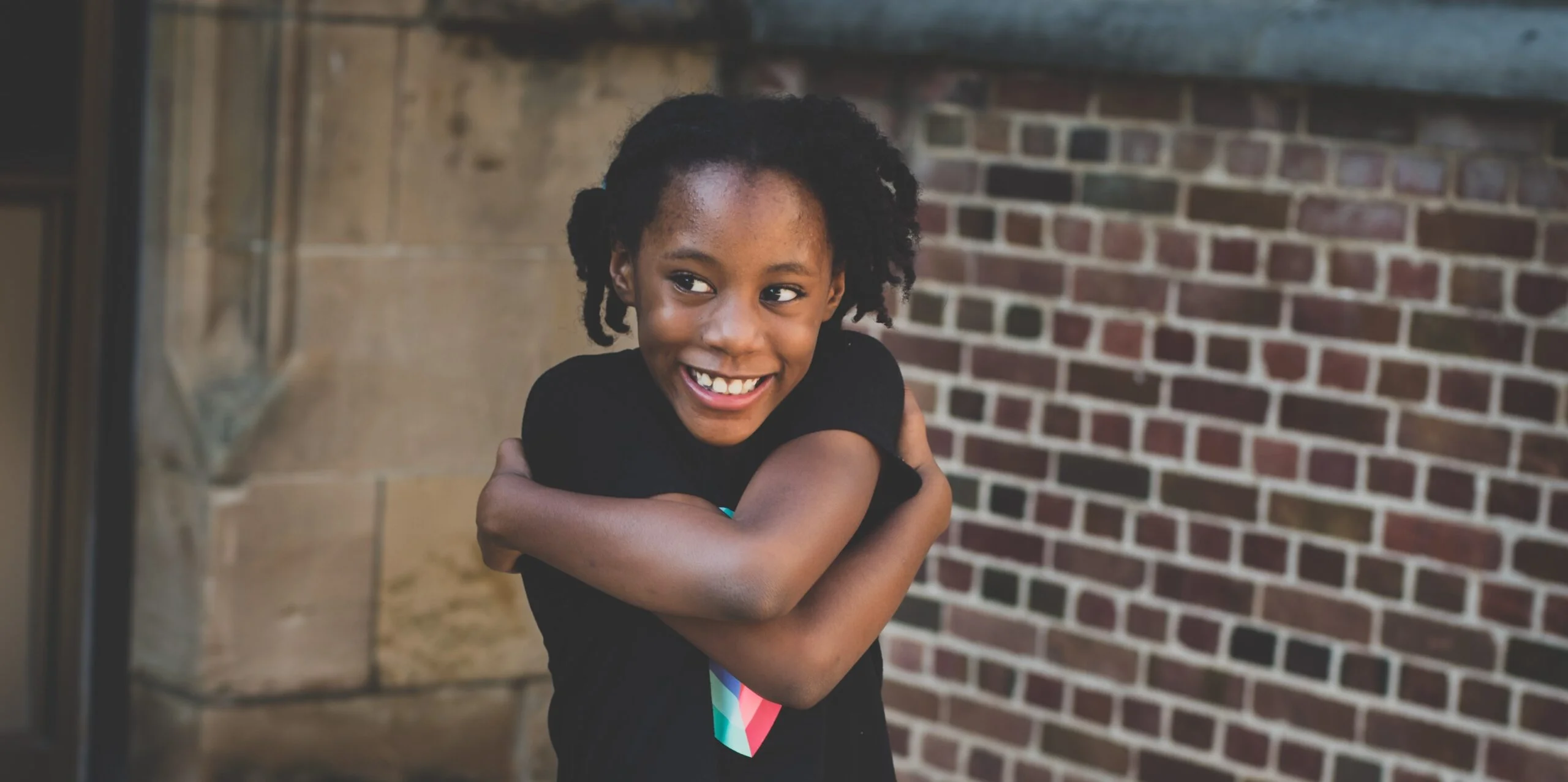 Girl Hugging Herself