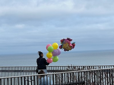 A woman with balloons