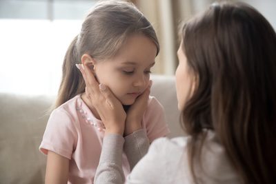 Mother talking to a child.